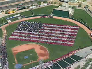 Tucson Electric Park. Thousands show support for the USA by forming a human flag. Click here to go to KVOA Tucson website